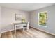 Bright home office features wood flooring and a large window at 1463 Jinright Rd, North Port, FL 34288