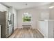 Bright kitchen nook with bench seating and a view of the backyard at 1463 Jinright Rd, North Port, FL 34288