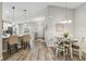 Open concept kitchen and dining area with island and stainless steel appliances at 1463 Jinright Rd, North Port, FL 34288