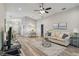 Bright and open living room with hardwood floors and a ceiling fan at 1463 Jinright Rd, North Port, FL 34288