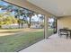 Spacious screened porch overlooking the backyard at 1463 Jinright Rd, North Port, FL 34288