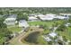 Aerial view of clubhouse and pond at 1570 Monarch Dr, Venice, FL 34293