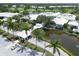 Aerial view of clubhouse entrance and landscaping at 1570 Monarch Dr, Venice, FL 34293