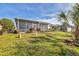 Spacious backyard with screened porch, providing ample outdoor space at 1570 Monarch Dr, Venice, FL 34293