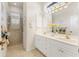 Elegant bathroom with double vanity,walk-in shower, and tiled floors at 1570 Monarch Dr, Venice, FL 34293