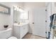 Clean bathroom with single vanity and access to shower at 1570 Monarch Dr, Venice, FL 34293