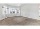 Spacious bedroom with neutral carpet and ceiling fan at 1570 Monarch Dr, Venice, FL 34293