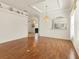 Bright dining room features hardwood floors and a chandelier at 1570 Monarch Dr, Venice, FL 34293
