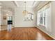 Spacious dining room with hardwood floors and views to kitchen at 1570 Monarch Dr, Venice, FL 34293