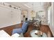 Elegant dining room with hardwood floors, chandelier, and a table set for dinner at 1570 Monarch Dr, Venice, FL 34293