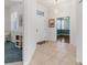 Bright and spacious entryway with tile flooring and access to other rooms at 1570 Monarch Dr, Venice, FL 34293