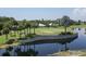 Golf course with pond and palm trees at 1570 Monarch Dr, Venice, FL 34293