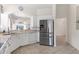 Kitchen boasts stainless steel appliances and white cabinetry at 1570 Monarch Dr, Venice, FL 34293