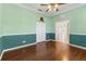 Bright office with hardwood floors and view to the living room at 1570 Monarch Dr, Venice, FL 34293