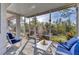 Enjoy the outdoors in this screened porch with comfy seating at 1570 Monarch Dr, Venice, FL 34293