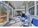 Bright and airy screened porch with comfortable seating area at 1570 Monarch Dr, Venice, FL 34293