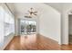 Sunroom with hardwood floors, access to the backyard, and plenty of natural light at 1570 Monarch Dr, Venice, FL 34293