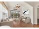 Sunroom with wicker furniture and sliding doors leading to the backyard at 1570 Monarch Dr, Venice, FL 34293