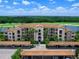 Upscale condo building with covered parking and beautiful landscaping at 17108 Vardon Ter # 203, Lakewood Ranch, FL 34211