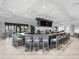 Large bar with comfortable seating and multiple screens at 17108 Vardon Ter # 203, Lakewood Ranch, FL 34211