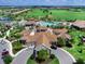 Lakewood National clubhouse with pool and tennis courts at 17108 Vardon Ter # 203, Lakewood Ranch, FL 34211