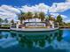Lakewood National entrance sign reflected in water at 17108 Vardon Ter # 203, Lakewood Ranch, FL 34211