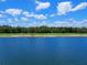 Waterfront golf course with lush greens and mature trees at 17108 Vardon Ter # 203, Lakewood Ranch, FL 34211