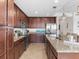 Spacious kitchen boasts granite counters, stainless steel appliances, and ample cabinetry at 17108 Vardon Ter # 203, Lakewood Ranch, FL 34211