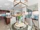 Open kitchen with granite countertops and stainless steel appliances, adjacent to a dining area at 17108 Vardon Ter # 203, Lakewood Ranch, FL 34211