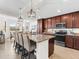 Modern kitchen with granite countertops and stainless steel appliances at 17108 Vardon Ter # 203, Lakewood Ranch, FL 34211