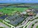 Aerial view of tennis courts near clubhouse at 17108 Vardon Ter # 203, Lakewood Ranch, FL 34211