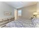 Charming bedroom with a queen-size bed and plenty of natural light at 17120 Cresswind Ter, Bradenton, FL 34211