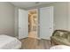 Bedroom with two doors and a view into the adjacent bathroom at 17120 Cresswind Ter, Bradenton, FL 34211