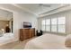 Spacious bedroom with large windows, wood floor, and built-in entertainment center at 17120 Cresswind Ter, Bradenton, FL 34211