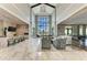 Spacious clubhouse with lounge area, kitchen, and high ceilings at 17120 Cresswind Ter, Bradenton, FL 34211