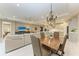 Formal dining area with a wooden table, chandelier, and neutral decor at 17120 Cresswind Ter, Bradenton, FL 34211