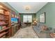 Spacious Gathering room with built-in shelving and a large TV at 17120 Cresswind Ter, Bradenton, FL 34211