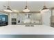 Modern kitchen with stainless steel appliances and white cabinetry at 17120 Cresswind Ter, Bradenton, FL 34211