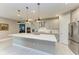 Open concept kitchen with island, stainless steel appliances, and white cabinets at 17120 Cresswind Ter, Bradenton, FL 34211