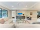 Bright living room with comfortable seating, a large TV, and access to backyard at 17120 Cresswind Ter, Bradenton, FL 34211