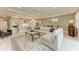 Open floor plan with a large sectional sofa and a view of the kitchen at 17120 Cresswind Ter, Bradenton, FL 34211