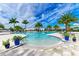 Relaxing pool with palm trees and patio furniture at 17120 Cresswind Ter, Bradenton, FL 34211