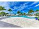Resort-style pool with palm trees and lounge chairs at 17120 Cresswind Ter, Bradenton, FL 34211