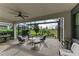 Relaxing screened patio with seating area overlooking pond at 17120 Cresswind Ter, Bradenton, FL 34211