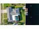 Bird's-eye view showcasing home's layout, pool, and private dock access at 181 Beeney Se Rd, Port Charlotte, FL 33952