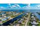 Aerial view of canal-front home with private dock and spacious backyard at 181 Beeney Se Rd, Port Charlotte, FL 33952