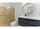Bathroom with walk in shower, toilet and floating vanity at 181 Beeney Se Rd, Port Charlotte, FL 33952
