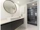 Modern bathroom with floating vanity, large mirror, and walk in shower at 181 Beeney Se Rd, Port Charlotte, FL 33952