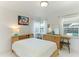 Bedroom with mid century modern furniture and pool view at 181 Beeney Se Rd, Port Charlotte, FL 33952