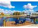 Private dock with blue chairs overlooking the canal at 181 Beeney Se Rd, Port Charlotte, FL 33952